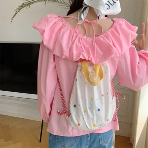 Zaino con coulisse in tela a pois colorati, manici gialli, ideale per l'uso quotidiano.