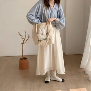 Japanese style cute corduroy tote bag with rabbit embroidery, casual shoulder bag for students.