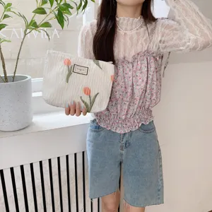 Tulip embroidered pleated pouch bag, white portable cosmetic organizer storage handbag detail.