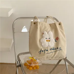 Cute corduroy tote bag with rabbit embroidery, casual shoulder bag for women and students.