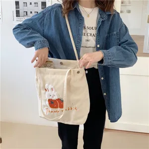 Japanese style cute corduroy shoulder bag with rabbit embroidery for daily casual student use.
