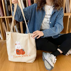 Corduroy cute rabbit embroidery shoulder bag detail view, casual literary style tote.