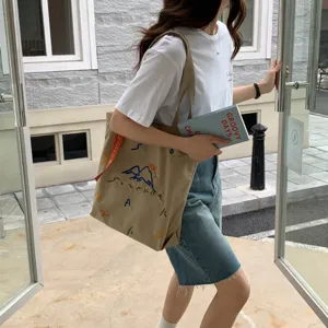 Sac cabas en toile pour femme, grand sac bandoulière avec broderie colorée et sangle.