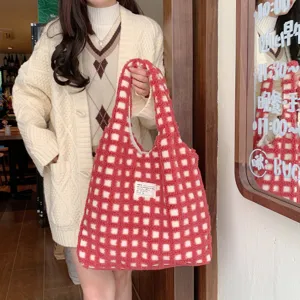 Detailed view of the red and white checkered plush tote bag, perfect for daily commuting and school.