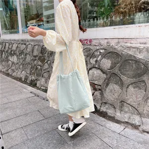 Light green cotton linen tote bag for women, simple casual single shoulder shopping bag detail.