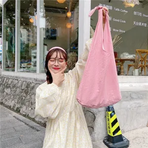 Korean style solid color canvas tote bag casual shoulder bag for women daily wear.