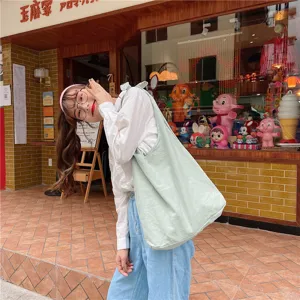 Casual minimalist canvas shoulder bag for women, fresh solid color tote bag with strap design.