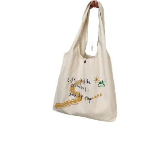 Casual canvas tote bag with stylish letter print, large capacity shoulder bag for daily use.
