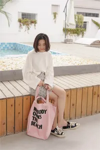Canvas tote bag for women, casual large capacity shoulder bag with stylish letter print for daily use.