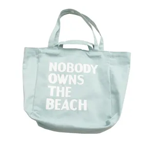Light blue canvas tote bag with double handles and front letter print for daily shopping.