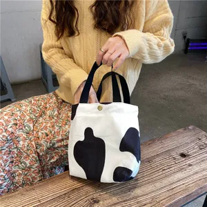 Corduroy lunch handbag detail featuring cute black white pattern and soft fabric texture.