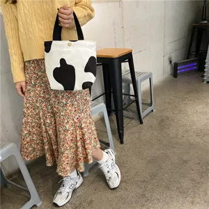 Corduroy lunch handbag with cute cow print, small tote bag for daily casual matching.