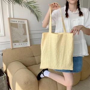 Detail shot of the yellow bubble plaid shoulder bag, featuring a fresh Japanese style canvas design.