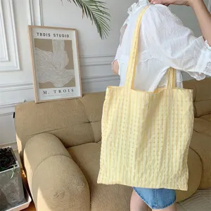 Detailed showcase of the yellow bubble plaid shoulder tote bag, lightweight Japanese casual style.