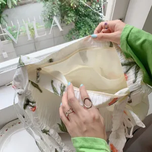 Tulip print tote bag interior detail, showcasing zipper pocket and spacious compartment design.