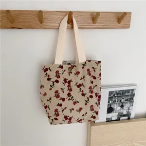Chic floral corduroy tote bag detail showcasing retro vintage rose print and sturdy woven handles.