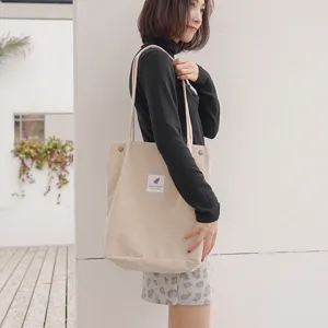 Korean style corduroy tote shoulder bag for women, large capacity casual shopping bag model view.