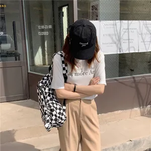 Sac à dos en toile à carreaux noirs et blancs, sac bandoulière minimaliste pour femmes.