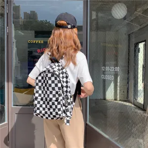 Sac à dos en toile à carreaux noir et blanc pour femmes, sac d'école décontracté, grande capacité.