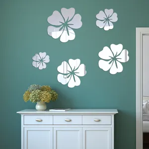 Acrylic mirror wall stickers detail showing 5 hibiscus flower pieces arranged on a green wall.