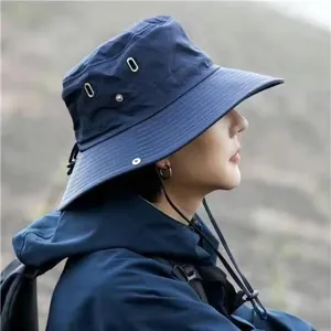 Outdoor hiking bucket hat for men women, navy blue sun protection cap with windproof strap.