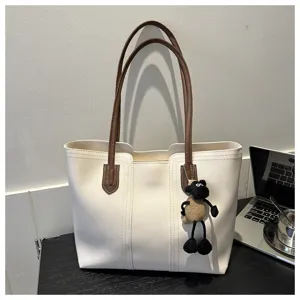 Casual large capacity tote bag for women, PU leather shoulder bag with cute sheep charm.