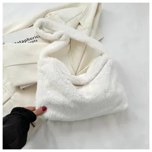 Detailed view of the white fluffy shoulder bag, soft plush texture and trendy underarm style.