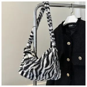 Fluffy zebra print shoulder bag detail, stylish plush underarm bag for women and daily wear.