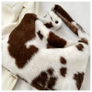 Fluffy cow print shoulder bag, cute plush hobo crossbody bag for women, stylish winter purse.