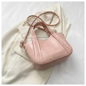 Pink litchi pattern soft leather women handbag, elegant casual shoulder crossbody bag detail.