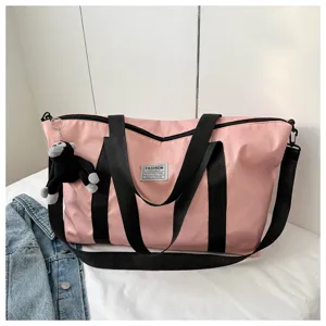 Large capacity pink travel tote bag with shoulder strap and cute monkey pendant for women