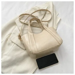 Casual PU leather tote bag for women, stylish bucket shoulder bag with top handle and strap.