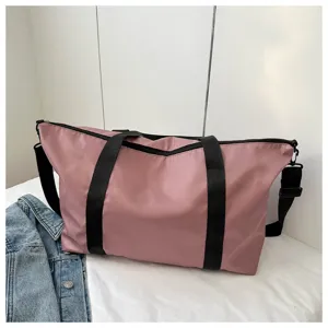 Details of the pink casual shoulder bag with black straps for travel and daily use and shopping.
