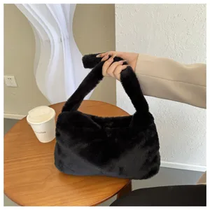 Black plush shoulder bag for women, cute furry underarm bag, soft winter fashion handbag.