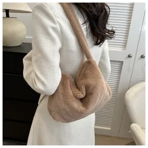 Detail shot of the brown faux fur shoulder bag, soft fluffy underarm hobo style texture.