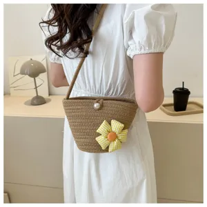 Chic straw woven crossbody bag with cute yellow plaid flower, stylish summer beach bucket bag.