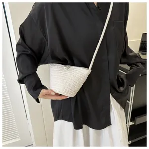 Detail view of the stylish woven shoulder bucket bag with pearl accent, perfect for daily commute.