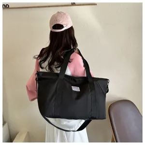 Large capacity black travel tote bag for women, casual shoulder bag and mommy handbag.