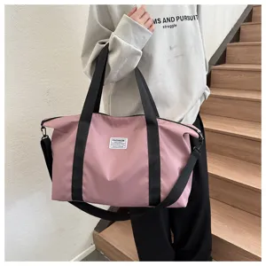Large capacity casual pink travel shoulder bag for women, stylish tote bag for daily use.
