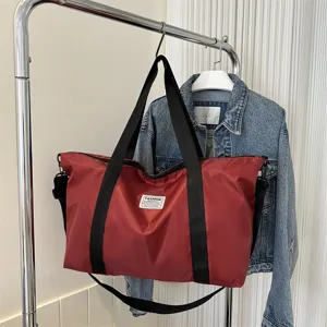 Large capacity red canvas tote bag shoulder bag casual travel handbag for women main view.