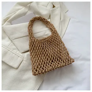 Close-up of Korean style hand-knotted brown mesh woven handbag, casual style detail shot.