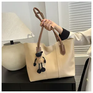 Korean style PU leather tote bag with brown handle and cute sheep pendant for women.