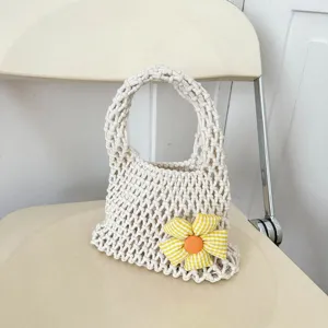 Korean style macrame woven handbag casual tote bag with cute fabric flower decoration.