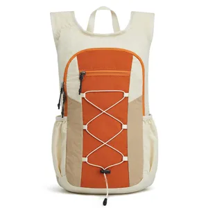 Detail view of colorblock outdoor cycling backpack with front bungee cord and handy zip pocket.