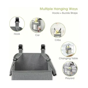 Hanging baby diaper organizer storage bag with hooks and straps for crib car use.