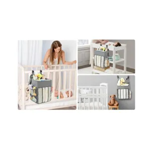 Hanging diaper organizer for crib, baby nursery storage bag with multiple mesh pockets.