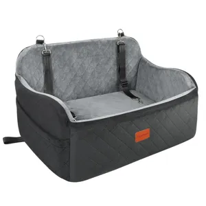 Gray quilted pet car seat detail showing plush velvet interior and secure safety strap buckles.