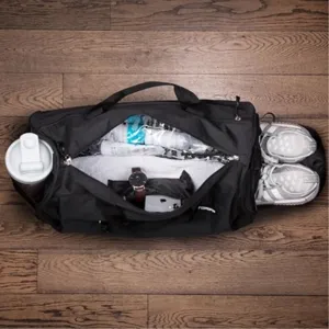 Sac de voyage de sport noir avec compartiment à chaussures et poches multiples fitness.
