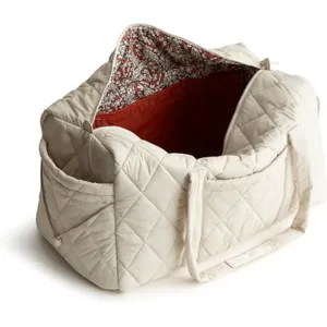 Quilted travel duffle bag detail view, large capacity tote with multiple inner pockets.