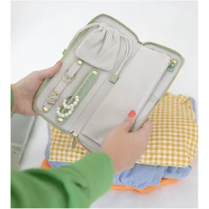 Portable travel jewelry organizer bag with zipper closure and multiple storage compartments.